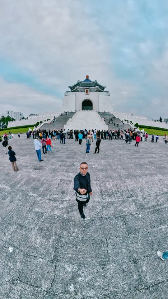 A wide-angle selfie in a huge stone plaza