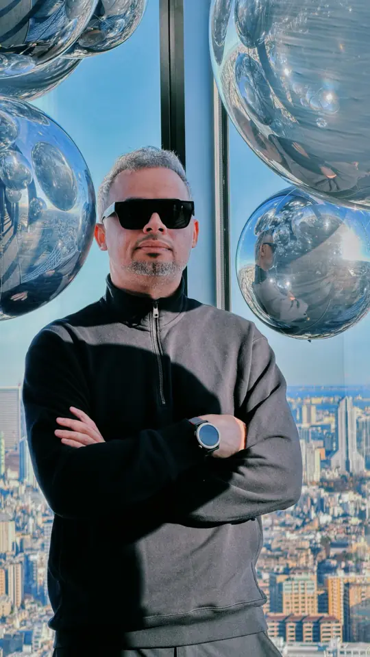 A portrait against a high-rise skyline